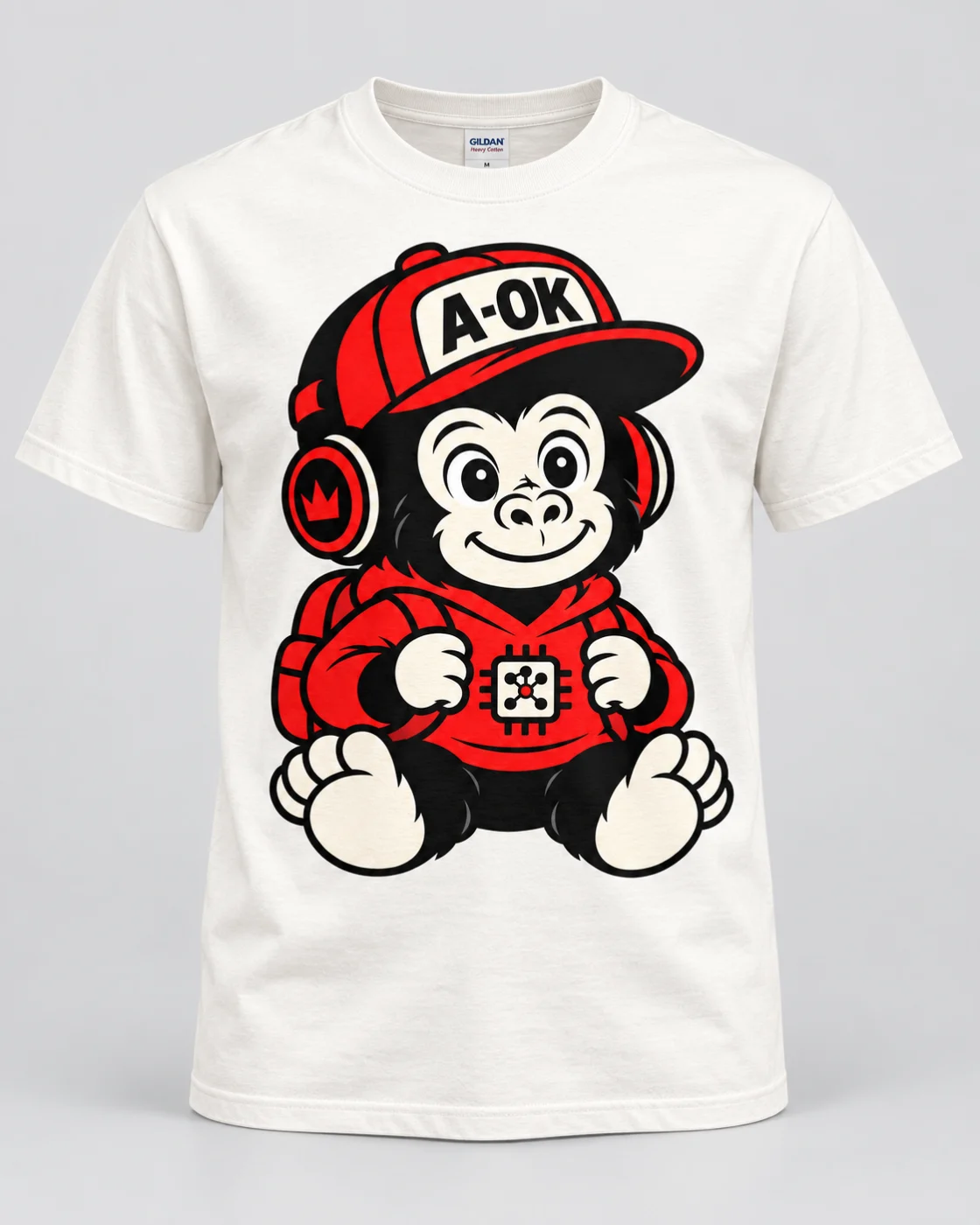 White T-shirt with a centered red, black, and cream baby ape graphic wearing an A-OK cap, headphones, a hoodie with a microchip emblem, and a backpack.